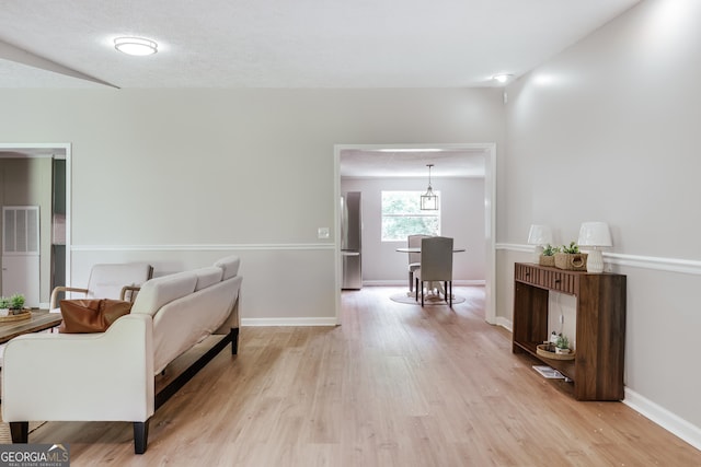 4419 New Kings Bridge Rd, Nicholson, GA 30565 - living area with light wood-style flooring and baseboards