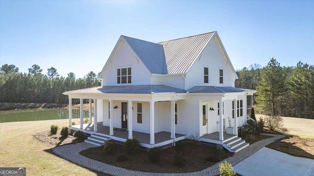 view of front facade featuring covered porch and a water view