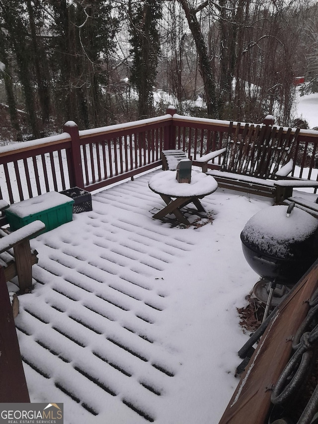 view of snow covered deck