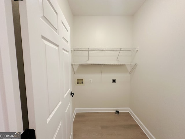 laundry area featuring hookup for a washing machine, electric dryer hookup, and hardwood / wood-style floors