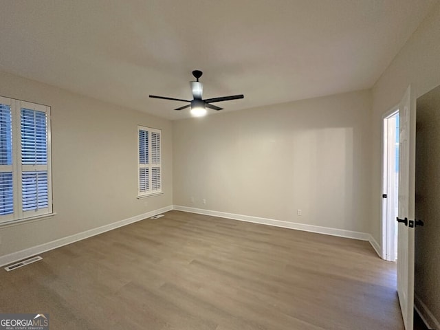 spare room featuring ceiling fan and light hardwood / wood-style flooring