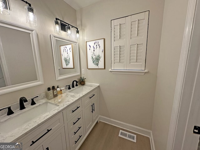 bathroom featuring wood-type flooring and vanity