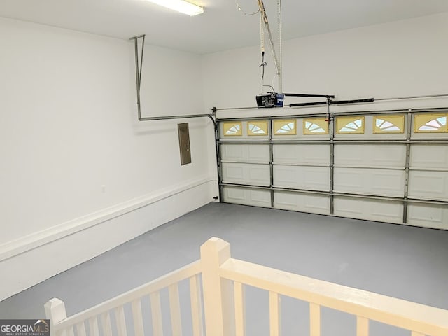 garage featuring a garage door opener and electric panel