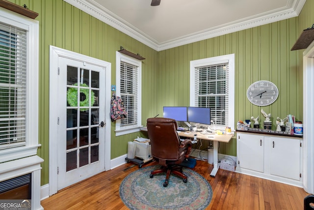 office with hardwood / wood-style floors and crown molding