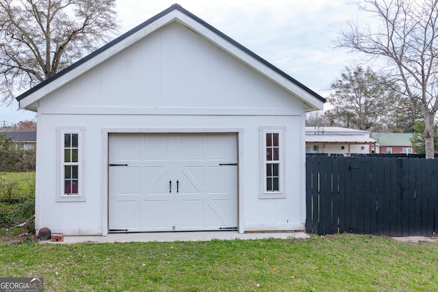 garage featuring a yard