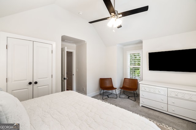 bedroom featuring ornamental molding, light carpet, a closet, and lofted ceiling