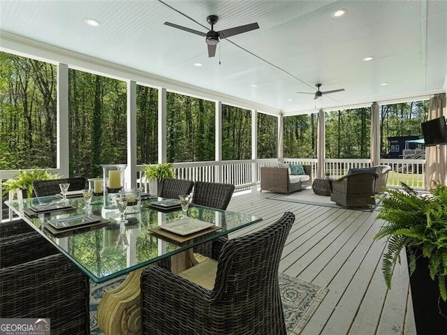 sunroom / solarium with ceiling fan