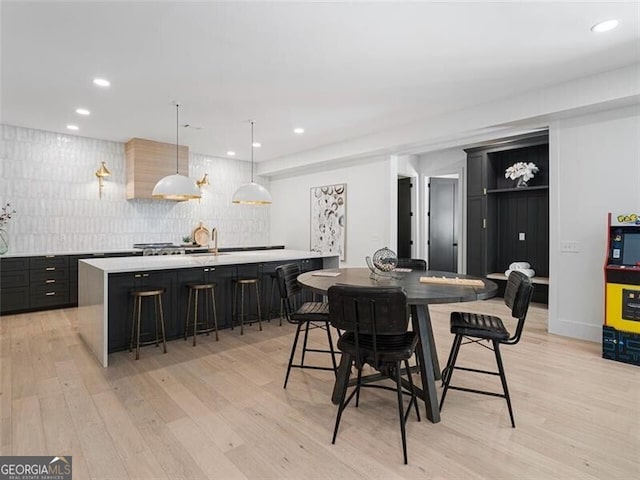 dining space featuring light wood-type flooring