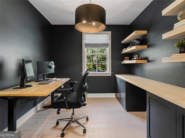 home office with light wood-type flooring