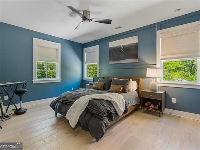 bedroom featuring light wood-type flooring and ceiling fan