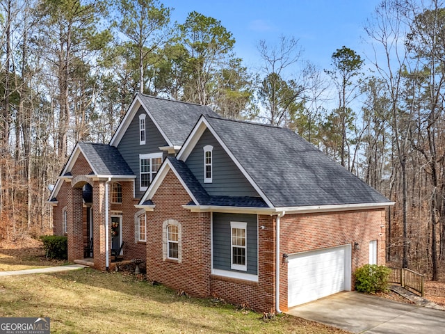 view of front of property featuring driveway, a garage, brick siding, roof with shingles, and a front yard