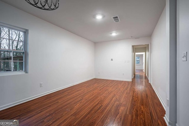 unfurnished room featuring dark hardwood / wood-style floors