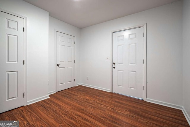 foyer with dark hardwood / wood-style floors