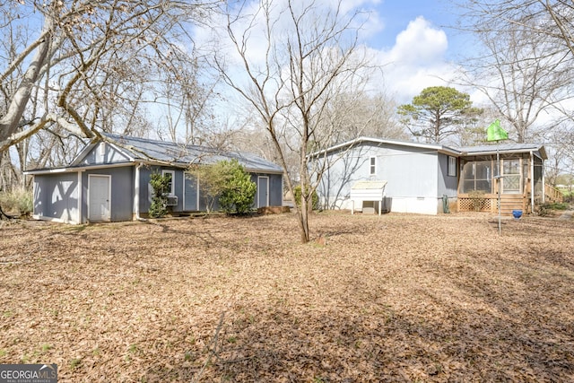 view of front of property featuring a sunroom