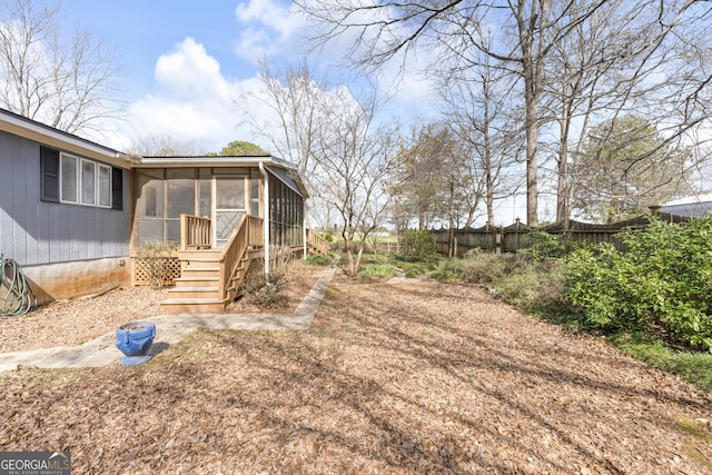 view of yard featuring a sunroom