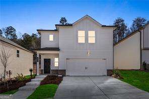 633 Groover St, Ball Ground, GA 30107 - traditional-style home featuring an attached garage and concrete driveway