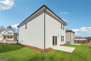633 Groover St, Ball Ground, GA 30107 - view of side of property featuring a patio and a yard