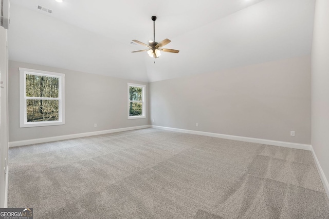 unfurnished room with carpet flooring, a ceiling fan, baseboards, and visible vents