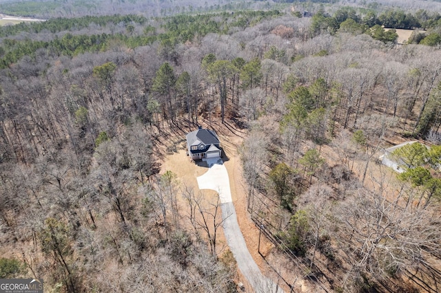 aerial view with a wooded view