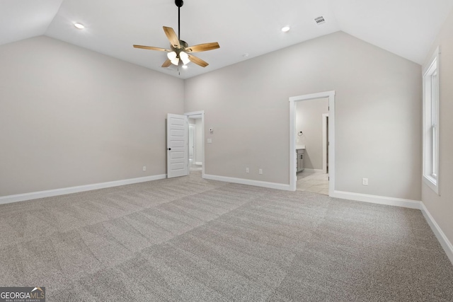 unfurnished bedroom featuring recessed lighting, vaulted ceiling, light carpet, and visible vents