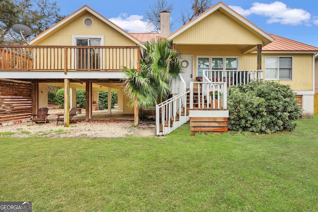 back of house with a porch and a lawn