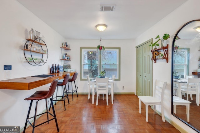 dining room with parquet floors