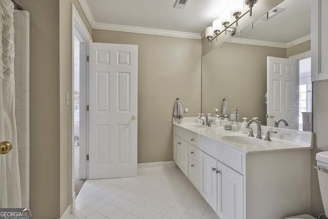 bathroom featuring ornamental molding, vanity, and tile patterned flooring