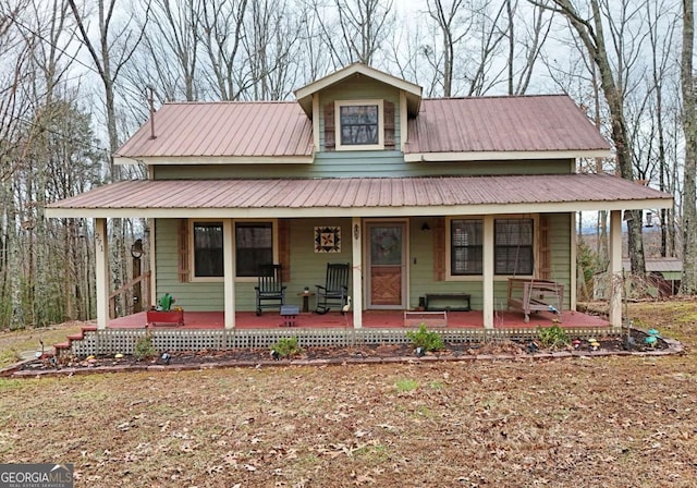 farmhouse inspired home featuring covered porch