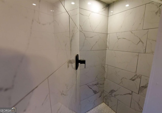 bathroom with tiled shower