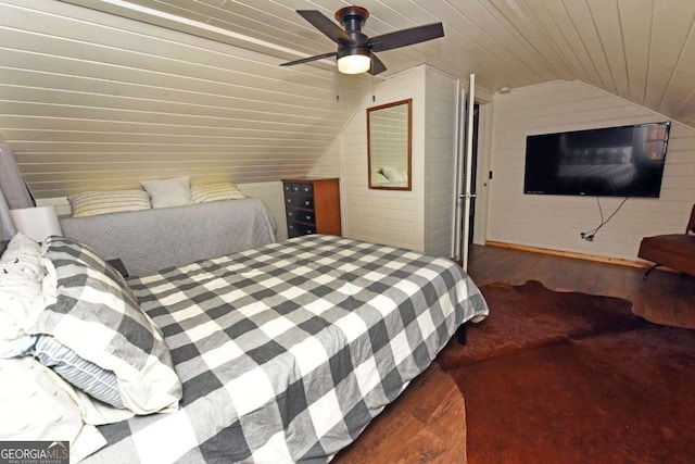 bedroom featuring ceiling fan, vaulted ceiling, wood ceiling, wood walls, and dark hardwood / wood-style floors