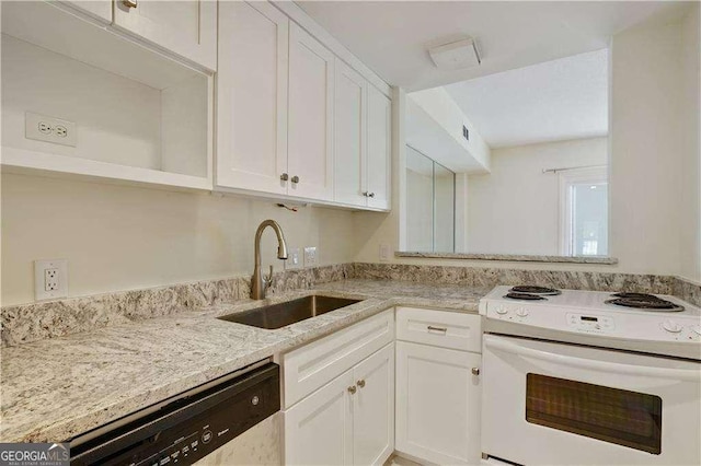 kitchen featuring sink, white electric range oven, white cabinets, and dishwasher