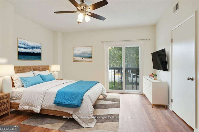 bedroom with ceiling fan, access to exterior, and hardwood / wood-style floors