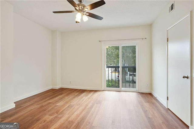 unfurnished room featuring light hardwood / wood-style flooring and ceiling fan