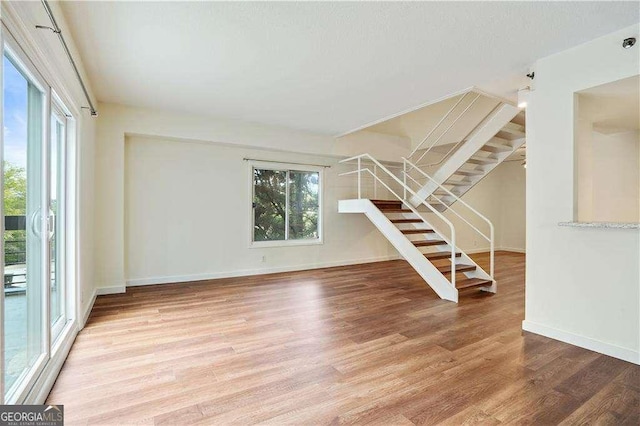 unfurnished living room featuring hardwood / wood-style floors