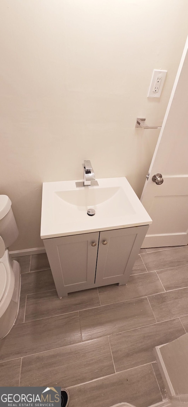 bathroom with vanity and toilet