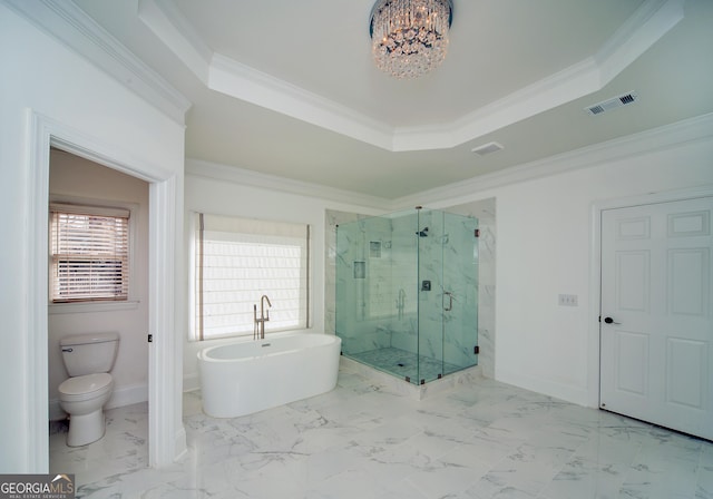 bathroom with a tray ceiling, shower with separate bathtub, crown molding, and toilet