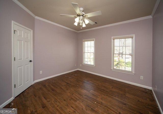 spare room with ceiling fan, crown molding, and dark hardwood / wood-style flooring