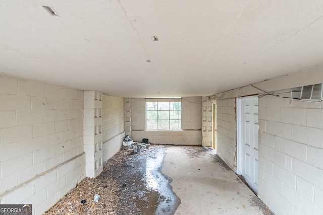 interior space featuring concrete block wall