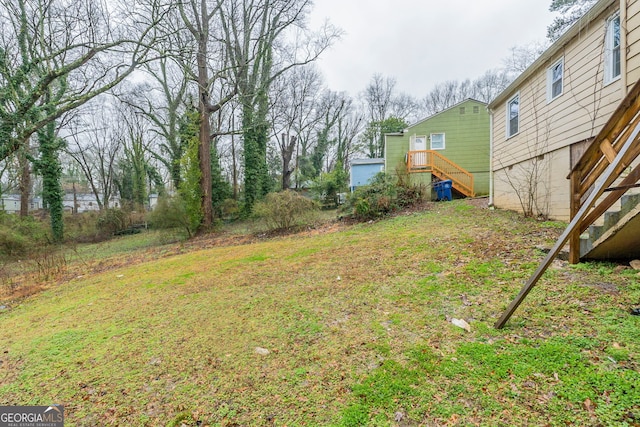 view of yard featuring stairway