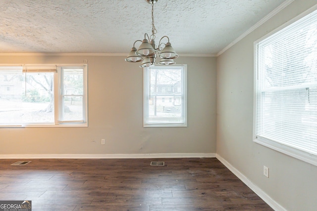 unfurnished dining area with dark wood-style floors, plenty of natural light, and visible vents