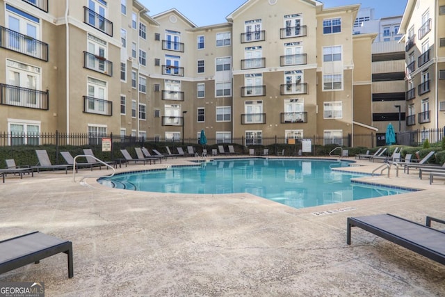 view of swimming pool featuring a patio area