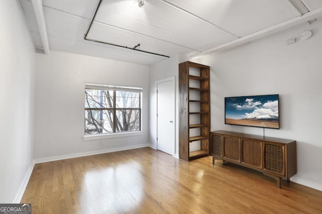 unfurnished living room with light hardwood / wood-style flooring