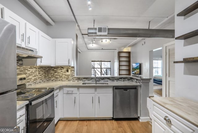 kitchen featuring white cabinets, stainless steel appliances, and sink