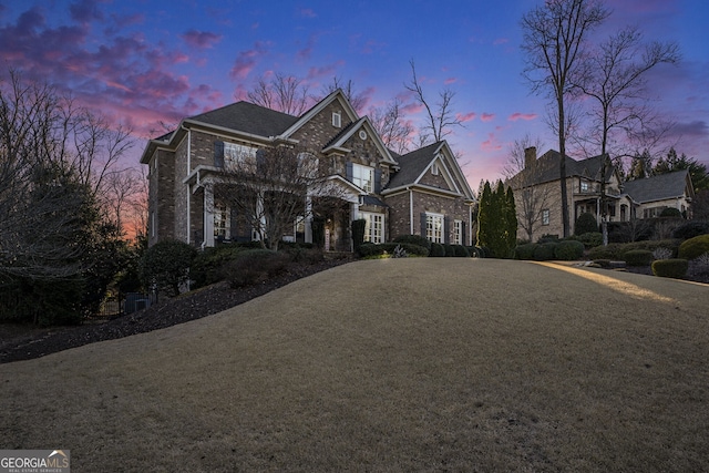 view of front of home with a yard