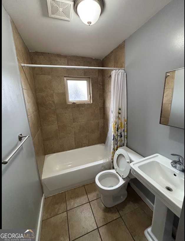 full bathroom with tile patterned flooring, visible vents, toilet, and shower / bath combo