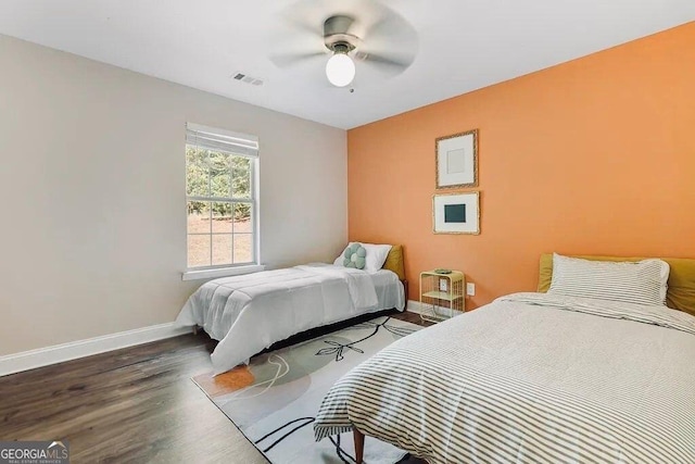 bedroom featuring ceiling fan and wood-type flooring