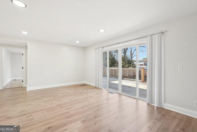 unfurnished living room with light wood-style flooring, visible vents, baseboards, and recessed lighting