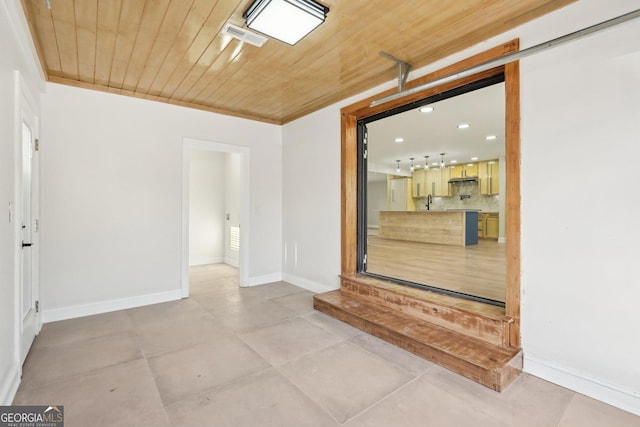 empty room featuring recessed lighting, wooden ceiling, visible vents, and baseboards