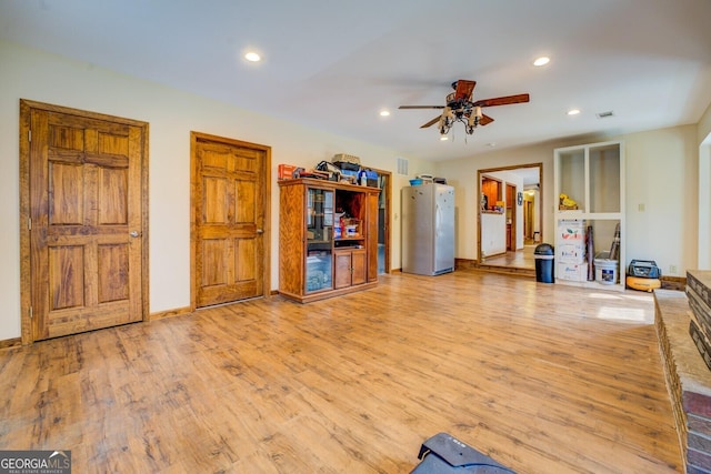 interior space featuring light hardwood / wood-style floors and ceiling fan