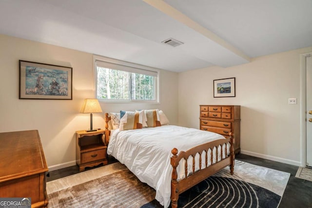 bedroom featuring visible vents and baseboards